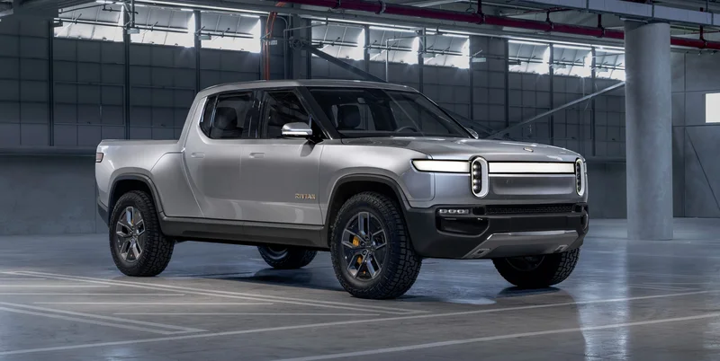 Rivian Stock: Price Volatility vs. Tesla and Layoff News